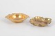 Two brass ashtrays.Decorative brass ashtrays with organic forms and undulating edges, executed ...