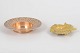 Two brass bowls.Decorative brass bowls, comprising one circular bowl with engraved border ...