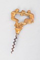 Mogens BallinDanish art nouveau brass corkscrew.Decorative cast brass corkscrew featuring a ...