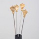Skultuna, set of four cocktail sticks with crown motif.