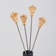 Skultuna, set of four cocktail sticks with crown motif.