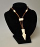 Greenlandic necklace with bone jewelry, 20th century. With leather. Total length: 80 cm.