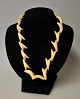 Greenlandic jewelry set made of walrus tooth, 20th century. Consisting of a chain with 19 links, ...