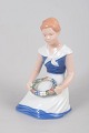 Bing & Grøndahl figurine no. 2345, seated girl with floral wreath.Porcelain figurine depicting ...