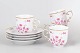 Set of four Hollóháza coffee cups with saucers, pink floral decoration.Elegant set of four ...