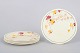 Alfred Meakin, set of five small Rusette plates.Set of five small Art Deco faience plates with ...