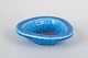 Gunnar Nylund for Rörstrand, chamotte dish with blue glaze.Circular stoneware dish with ...
