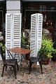A pair of decorative old French shutters with original light grey patinated colour with ...
