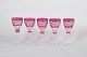 Set of five Bohemian wine glasses.Pink crystal glasses with cut and etched decoration in the ...