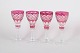 Set of four Bohemian wine glasses.Pink crystal glasses with cut and etched decoration in the ...