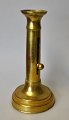 French Empire candlestick in brass, 19th century. H.: 18.5 cm.