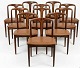 8 Fantastic Johannes Andersen chairs in solid rosewood. Produced by Uldum Møbler (Label). ...