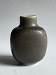 Royal Copenhagen: Miniature vase in ceramic designed by Nils Thorsson. Covered in a brown glaze. ...
