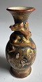 Smaller colorful Satsuma vase with delicate facial decorations and a dragon in gold winding ...