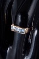 14 carat gold ring with light blue synthetic spinels.