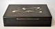 Andersen & Søhoel, Aarhus: Cigar box in bog oak with sterling silver inlays. Also match holder ...