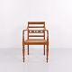Elegant armchair executed in an Empire and Biedermeier-inspired style from around the 1940s. The ...