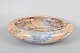 Arabia, large faience bowl.Large circular bowl in glazed faience with a marbled glaze in ...