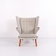 The Papa Bear Chair, model AP19, designed by Hans J. Wegner in 1951. Upholstered in light grey ...