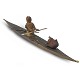 Greenlandic hunter sitting in a kayak wearing a leather suit with detailed tools and equipment. ...