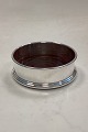 Silver Plated / Wood Bottle CoasterHas a small dent on the edge of the bottom, and scratches ...