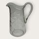 Glass jug, with cut flowers and leaves, 22.5cm high, 16.5cm wide, *Good condition*