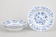 Meissen, set of four deep plates.Elegant porcelain set in the Blue Onion pattern, featuring ...