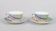 Gien "Savane", pair of coffee cups with matching saucers.Pair of faience coffee cups with ...
