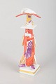 Peter Strang for Meissen, miniature figure.Hand-painted porcelain miniature figure with a ...