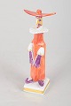 Peter Strang for Meissen, miniature figure.Hand-painted porcelain miniature figure with a ...