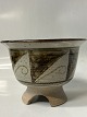 Ceramic bowl on foot, with brown nuances.Signed NANNA.Measures H 12.5 x 17.3 ...