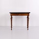 Antique games table crafted in polished mahogany and walnut, dating from the 1860s. The table ...