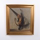 Signed oil painting depicting a hanging pheasant. The painting was created around the 1920s and ...
