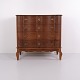 Large antique Baroque chest of drawers crafted from oak with a curved front and straight central ...