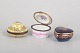 Set of Three Limoges Lidded Boxes.A set of three hand-painted porcelain lidded boxes in ...