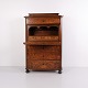 Antique secretaire from the 1840s made of hand-polished mahogany. The secretaire features four ...