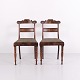 Pair of antique Late Empire salon chairs from the 1840s, made of mahogany. The chairs feature ...
