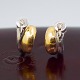 Ole Lynggaard gold jewelry.  Fidelity earrings in 14k gold and white gold. Adorned with two ...