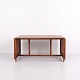 Danish design sofa table from the 1960s, made of teak. The table features extension leaves at ...