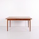 Teak dining table from the 1950s–60s featuring a draw-leaf extension system. The table has two ...