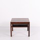 Side table / coffee table made of rosewood from the 1960s. The table features a square top and a ...