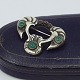 Mogens Ballin; Art Nouveau brooch in silver, decorated with garnet and chrysoprase.  Made by ...