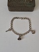 Bismarck silver bracelet with 3 charmsStamped 830Length 17.5 cm. Width 5 mm.Weight 7.5 grams.