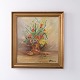 Flower painting depicting a bouquet, signed and dated 1920. The painting is presented in a ...
