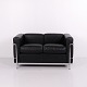 LC2 two-seater sofa in black leather with an exposed chromed steel frame. The model was designed ...