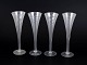 Set of four Swedish champagne glasses.Set of four tall champagne glasses, crafted in clear ...