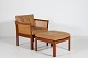 Illum Wikkelsø (1919-1999)Plexus Chair with matching footrest made of solid mahogany ...