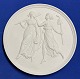 Round biscuit porcelain plaque featuring the motif "The Muses of Tragedy and Comedy." Created by ...
