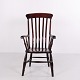 Antique armchair in dark wood, executed in the English Windsor style and dating from circa ...