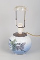 Royal Copenhagen, table lamp.Hand-painted porcelain table lamp, decorated with a botanical ...